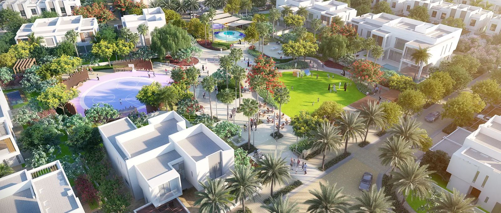Community swimming pool and green space at Al Zahia seen from above