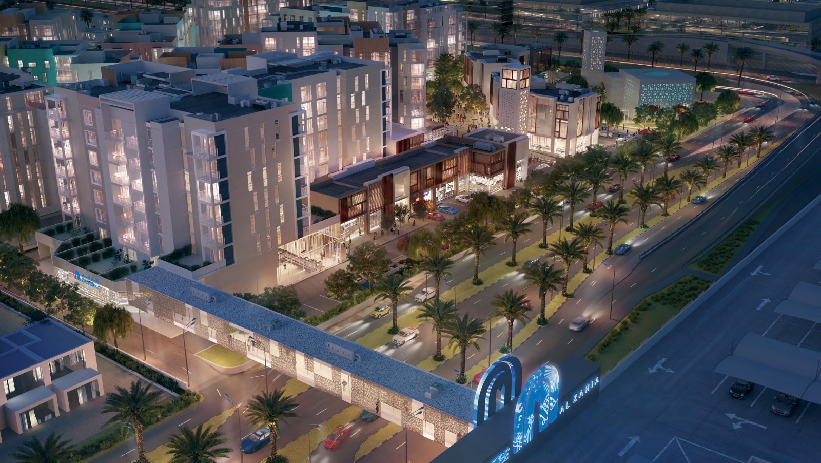 Aerial view of Uptown Zahia at dusk beside a main road in New Zahia, Sharjah