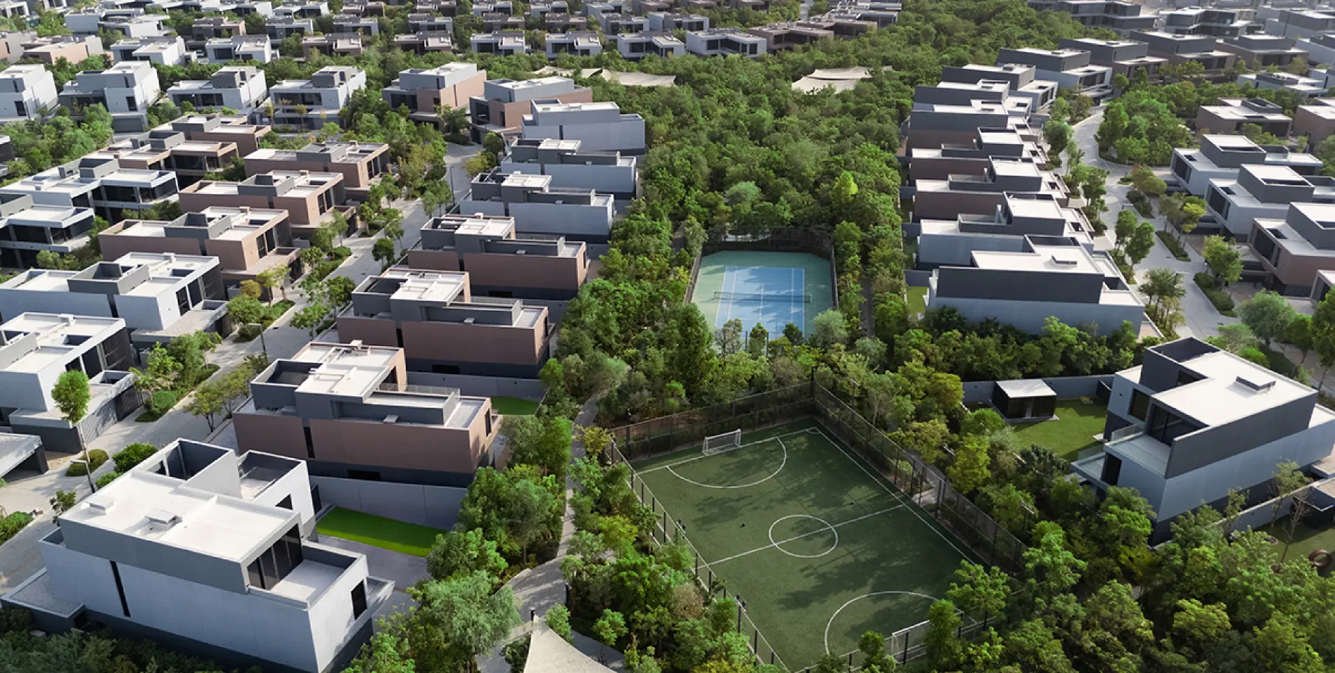 Aerial view of Masaar villa districts around the tennis court and football pitch