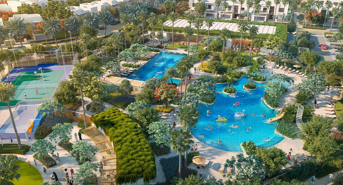 Aerial view of landscaped pools, gardens and tennis courts at Uptown Zahia, Sharjah