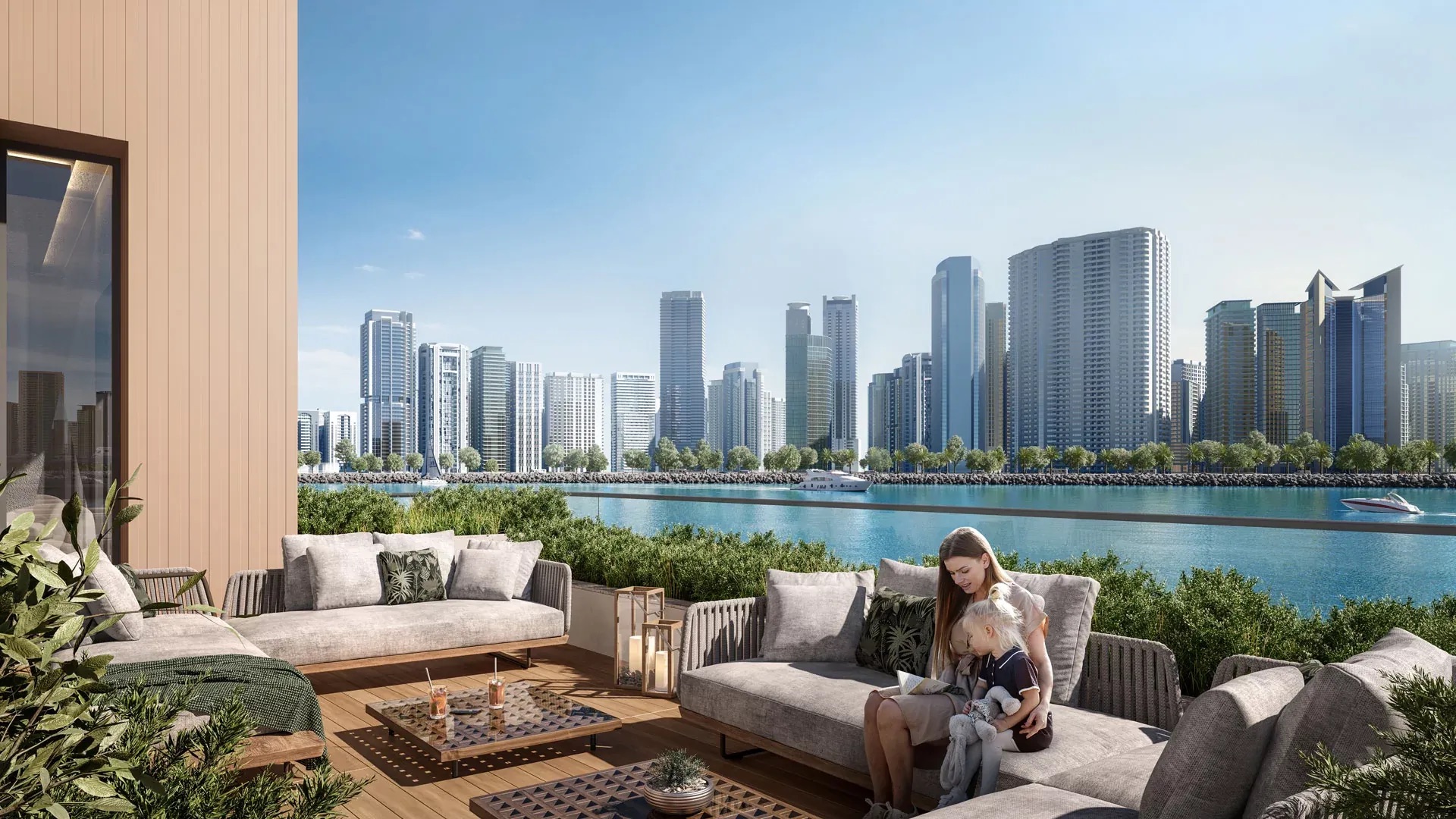 Living room with a balcony view over the water and the Sharjah skyline