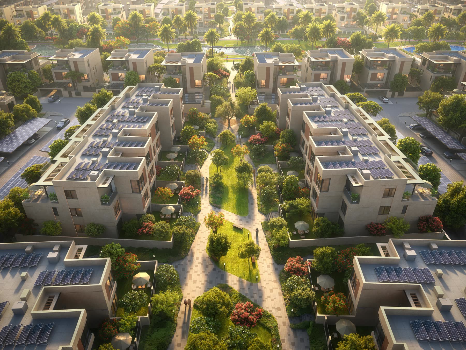 Shaded courtyard walkway lined with planting between homes at Sharjah Sustainable City II