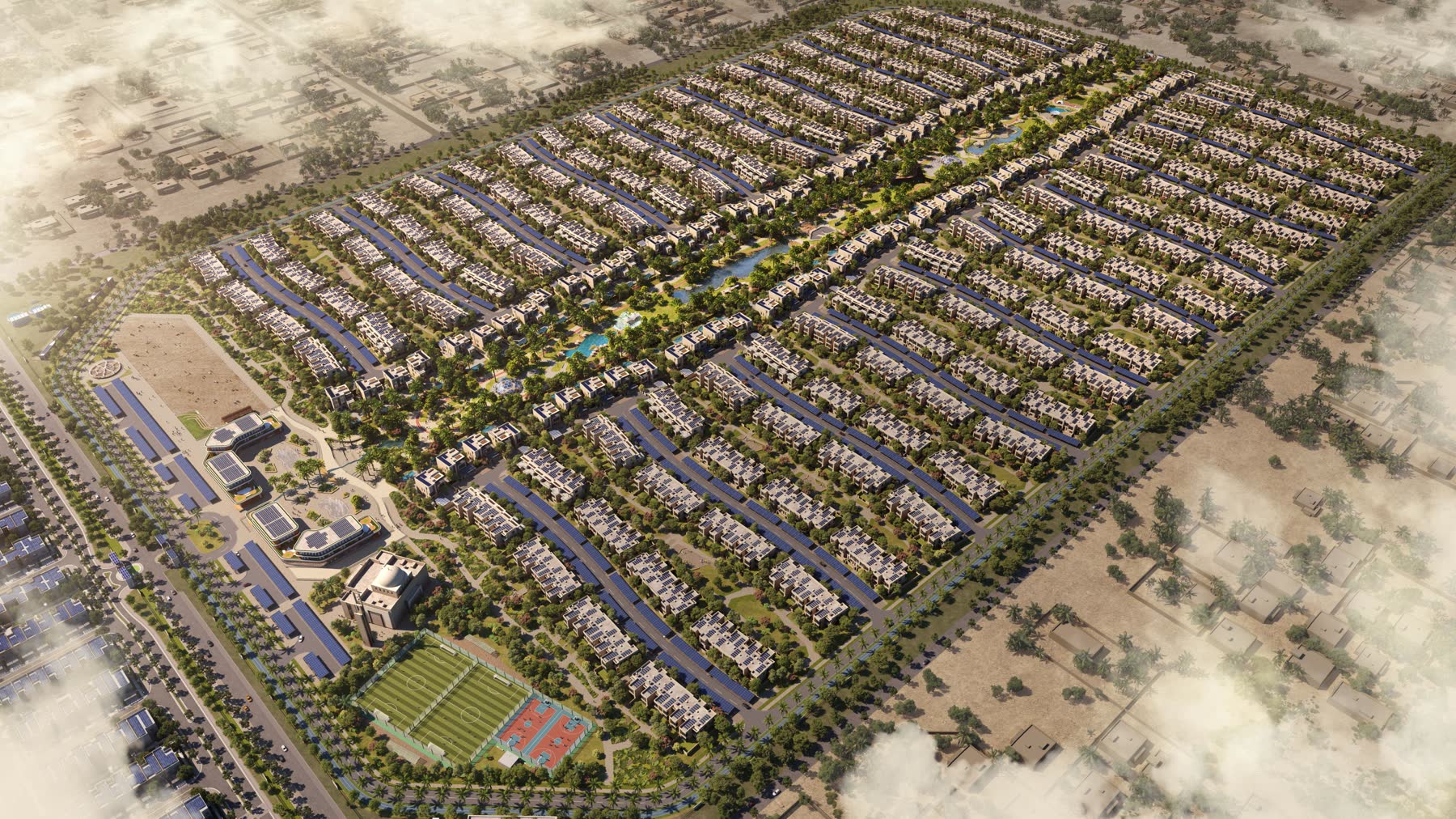 Aerial view of Sharjah Sustainable City II showing the green spine between clusters of homes