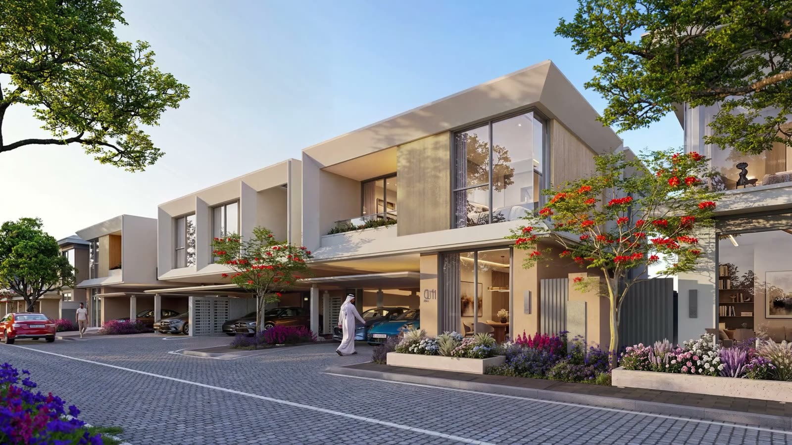 Townhouse row with covered parking and flowering flame trees